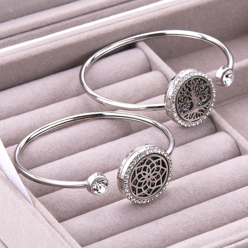 Two LoveLink Aromatherapy Bracelets - Stainless Steel with crystals on them.