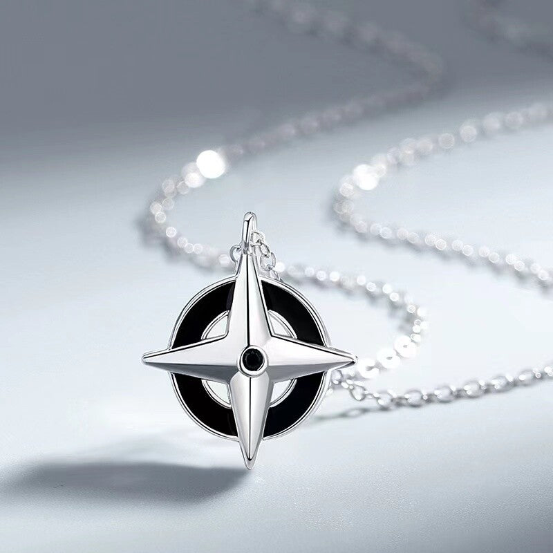 A Maramalive™ Enamel Compass Necklace - Sterling Silver on a chain.