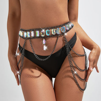 A woman in a black swimsuit with a Maramalive™ Multi Layer Waist Chain Body Jewelry.