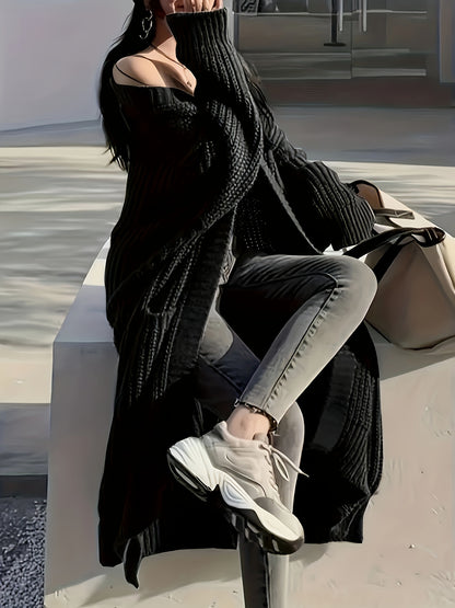 A person wearing a black Maramalive™ Plus Size Open Front Loose Knit Cardigan, Casual Long Sleeve Long Length Cardigan With Pocket, grey jeans, and white sneakers sits on an outdoor bench, holding a beige tote bag. The person's face is partially obscured by their hand.