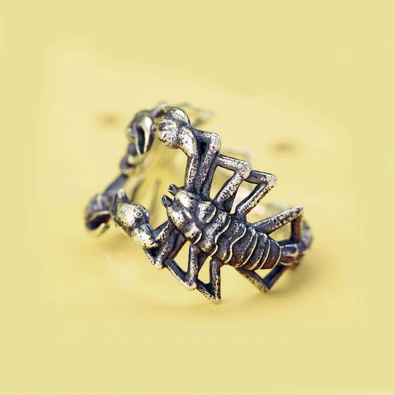 A person holding a Maramalive™ Silver Scorpion Ring.