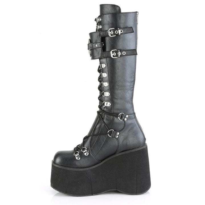 A woman wearing a pair of Maramalive™ Gothic Platform Wedge Heel Halloween Plus Size Boots For Women with fur integrated.
