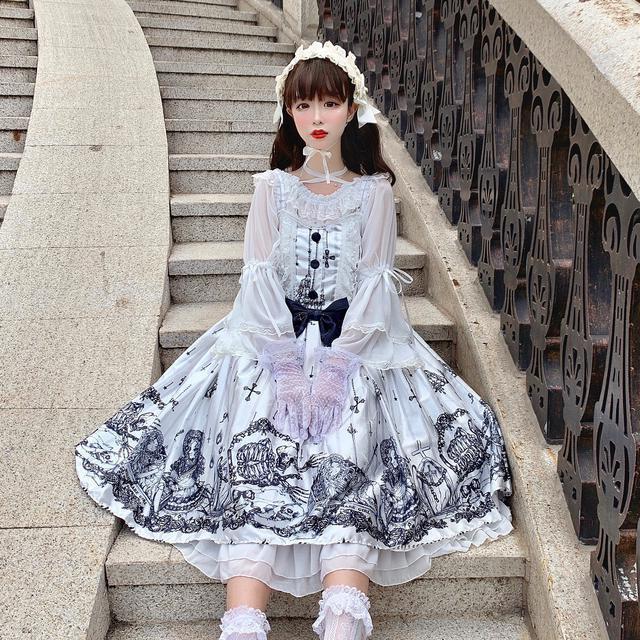 A girl in a sweet and fresh Maramalive™ Lolita JSK dress Tomb Prisoner Girl Gothic Dark Jsk Dress Dark Vintage Victorian Princess Party Dress Sleeveless lolita dress is standing in the woods.