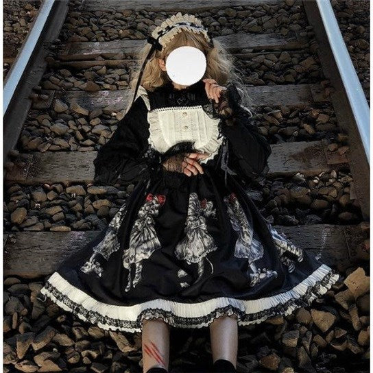 A Gothic girl in a Dark Retro Gorgeous Gothic Simple - Lolita Dress Suspender Skirt by Maramalive™ sits on a train track.