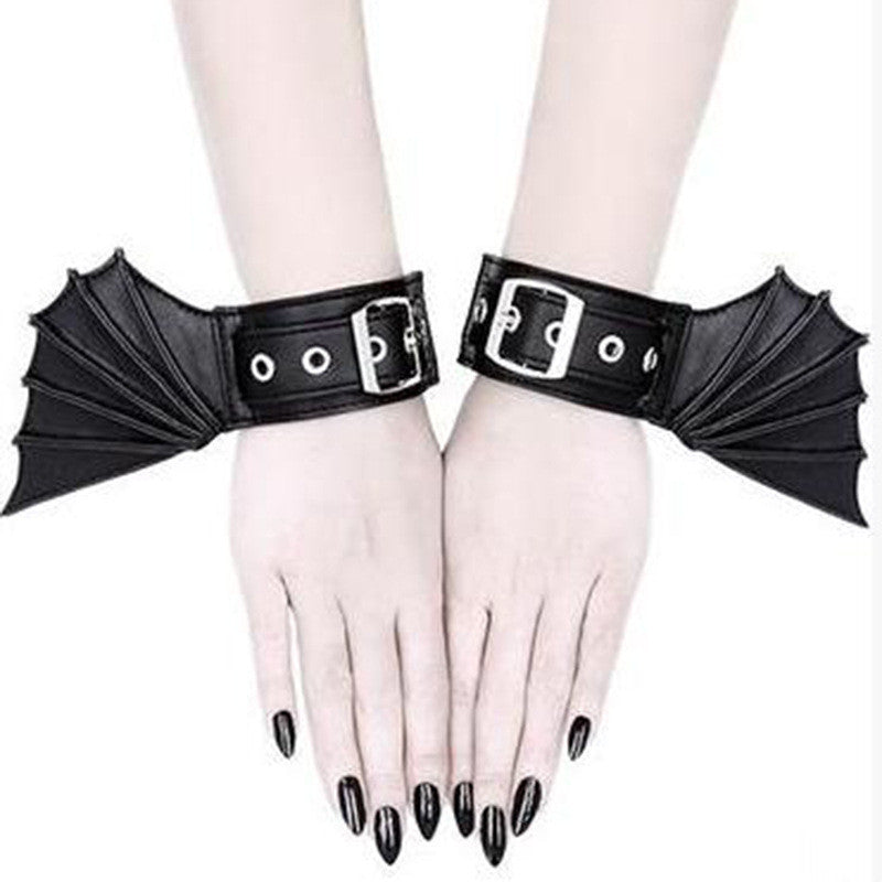 A woman donning Midnight Magic: Fashion Gothic Dark Wind Bat Wings Hand And Foot Accessories with bat wings, adding a touch of gothic glam to her attire. (Brand Name: Maramalive™)