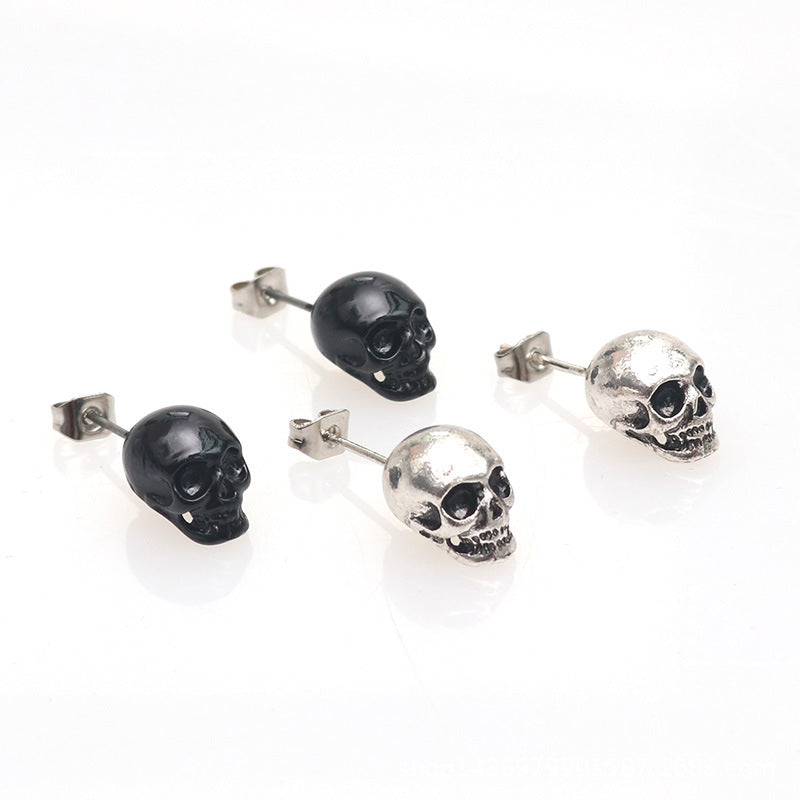 A woman's ear with a Personality Retro Skull Eardrops earring from Maramalive™.