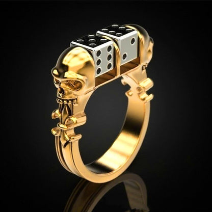 A Maramalive™ gold ring with a striking skull and dice on it.