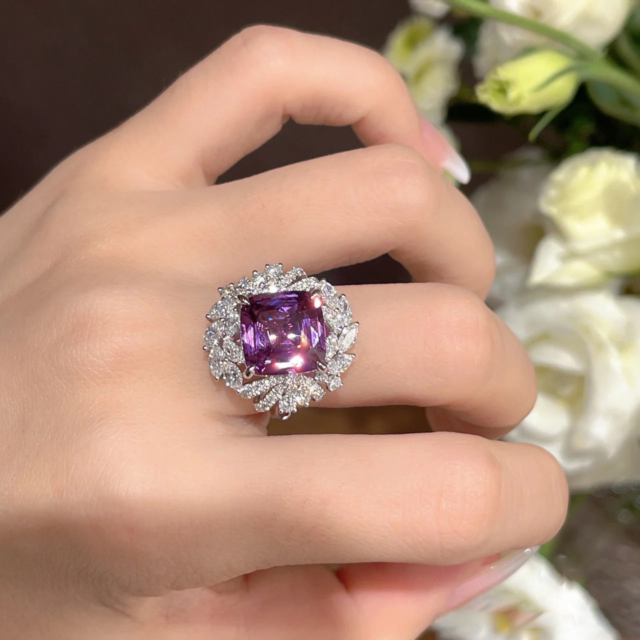 A woman's hand holding a purple Stand out Beautiful Amethyst Gemstone Ring For Women I NEED IT and diamond ring by Maramalive™.