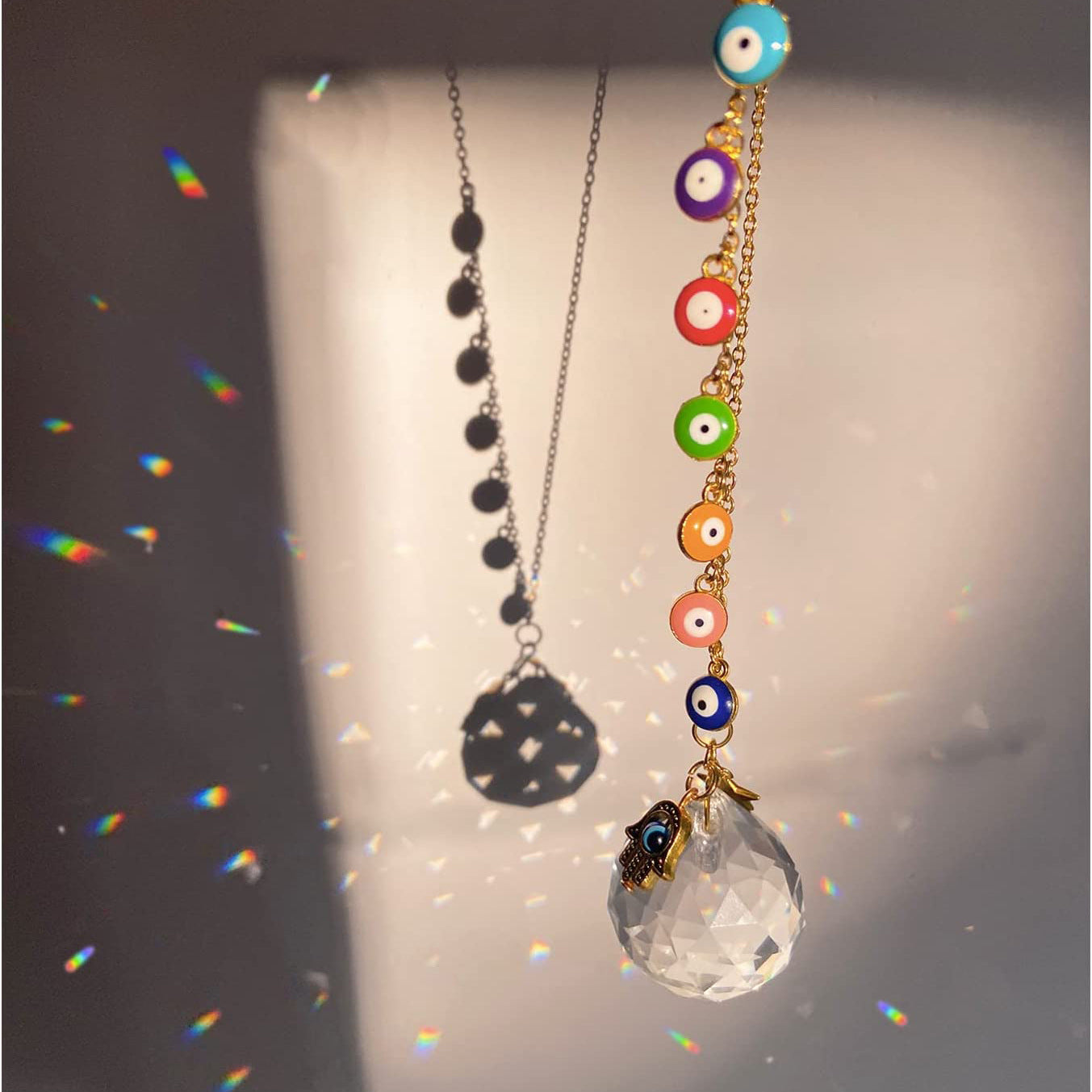 A Maramalive™ Prismatic Crystal Pendant necklace with a multi colored glass ball on it.