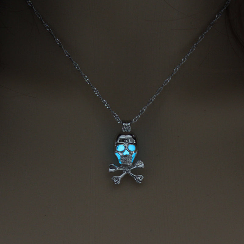 Three Halloween glow-in-the-dark skull necklaces on a mannequin.