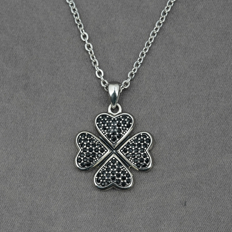 A Maramalive™ silver necklace with a Flower Running Micro Rhinestone Four-leaf Clover Titanium Steel Pendant.