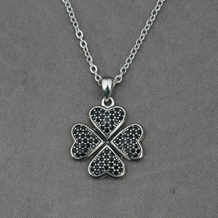 A Maramalive™ silver necklace with a Flower Running Micro Rhinestone Four-leaf Clover Titanium Steel Pendant.
