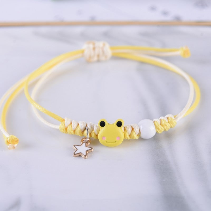A yellow Simple Cute Frog Bracelet For Women with a frog charm on it from Maramalive™.