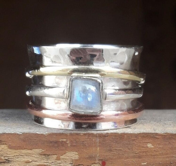 A Heavy Industry Ring Hand Jewelry by Maramalive™, with a blue stone on top.