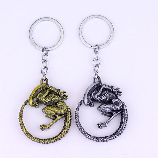 Two Simple And Creative Alien Battle Keychains with a skeleton on them, by Maramalive™.
