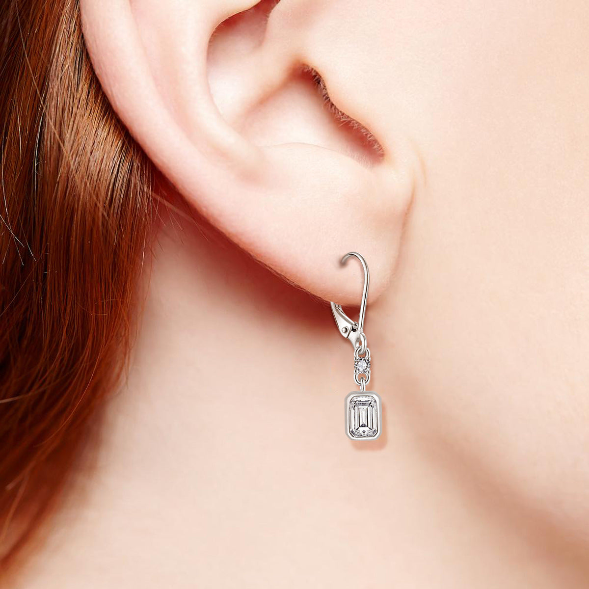 A woman's ear with an Unusual Stunning Rectangular Zircon Earrings Ear Hook S925 Silver earring from Maramalive™.