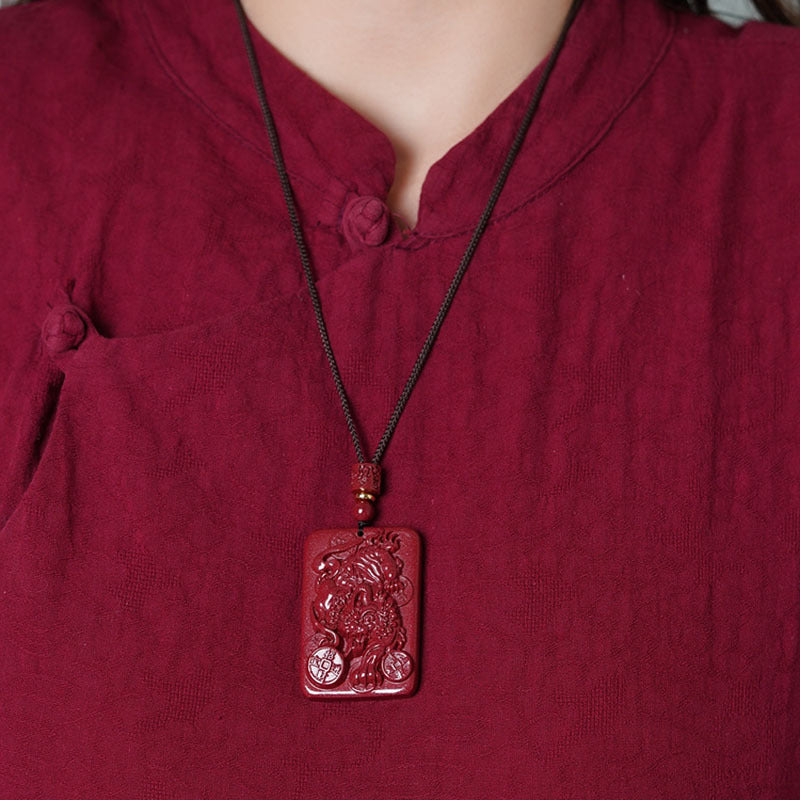 A woman wearing a red shirt with a Men's And Women's Fashion Raw Ore Purple Gold Sand Pendant Pendant Lucky Pendant necklace from Maramalive™.