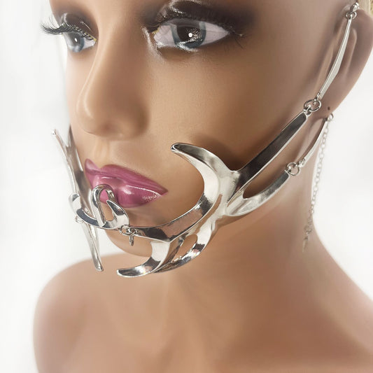 Close-up of a mannequin head wearing a unique Maramalive™ Adjustable Irregular Fluid Lip Ring Mask covering the mouth and chin area, featuring abstract metallic alloy shapes.