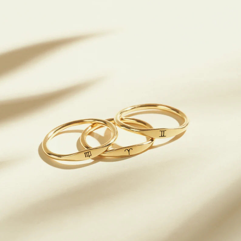 Three Twelve Constellations Minimalist Rings by Maramalive™ on a white surface.