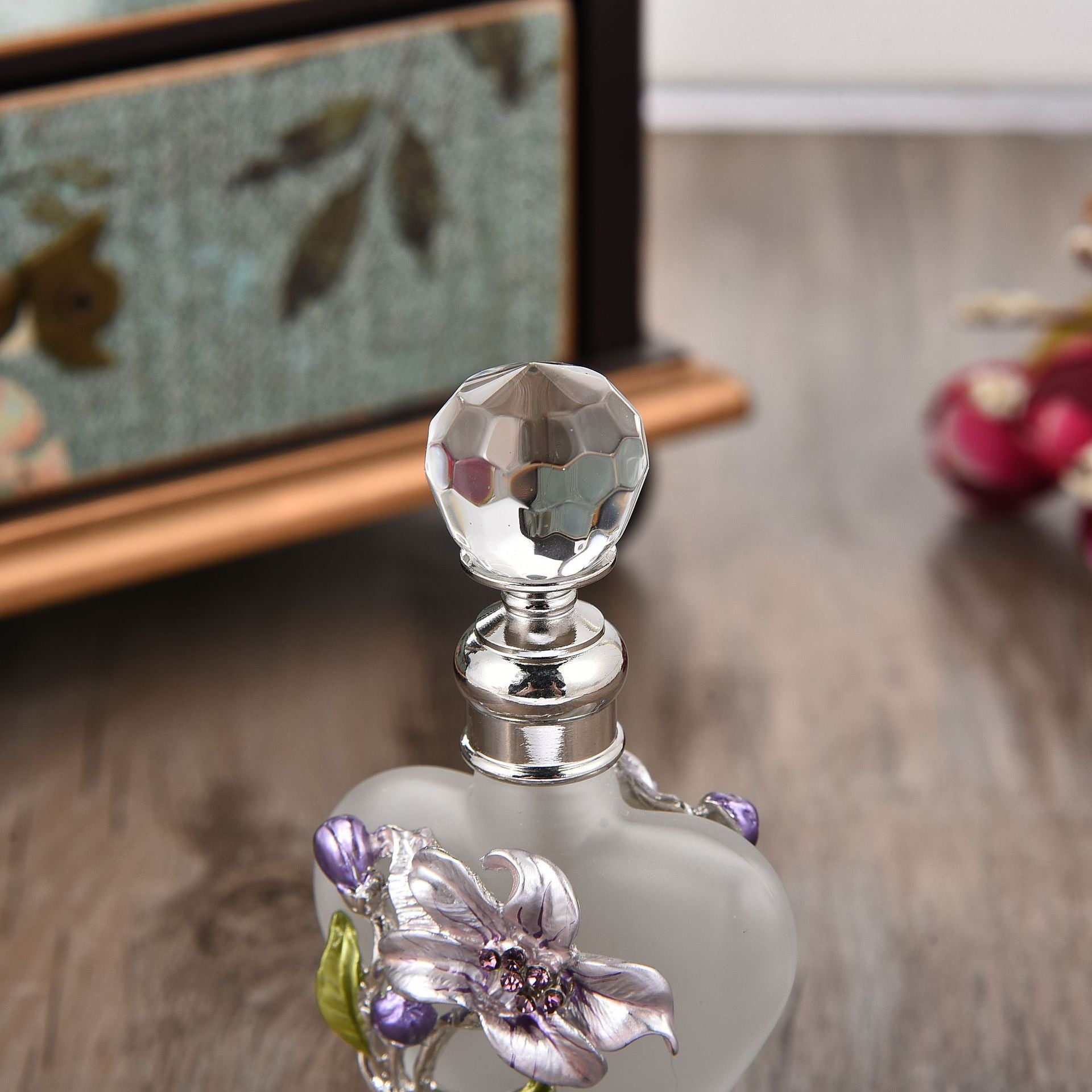A vintage Maramalive™ Orchid Perfume Glass Bottle 10ML adorned with delicate flowers, crafted in a charming heart shape.