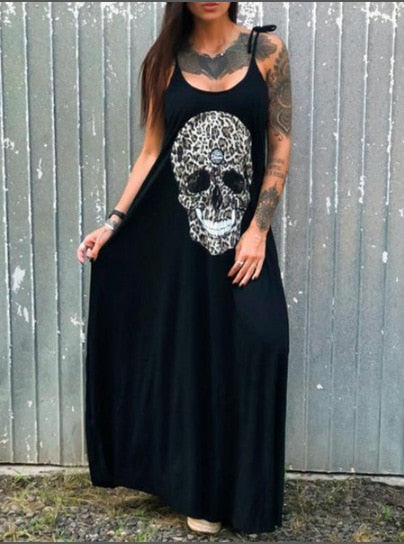 A woman in a ghoulishly glam black dress with a skull print wearing the Maramalive™ Drop Dead Gorgeous - Strap Style Skull Mid-length Print Dress.
