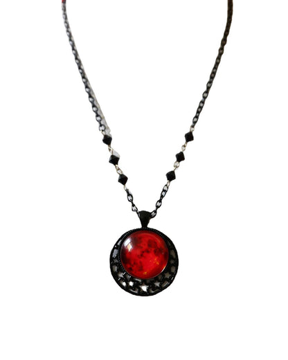 A mannequin is wearing a Moon Gothic Necklace with a moon on it by Maramalive™.