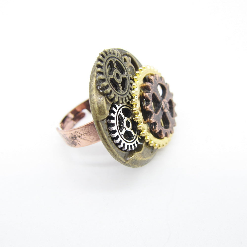A person is holding a small Maramalive™ European And American Jewelry Steampunk Series Ring with gears on it.