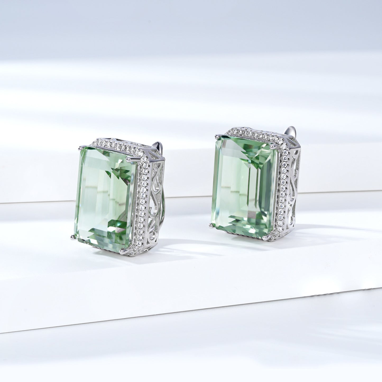 A pair of Natural Green Crystal earrings by Maramalive™, incorporating amethyst and diamond.