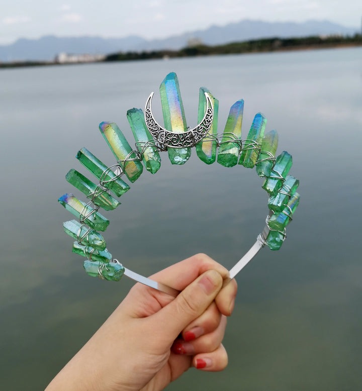 A person holding a Crystal Witch Headband with crystals on it. (Brand Name: Maramalive™)