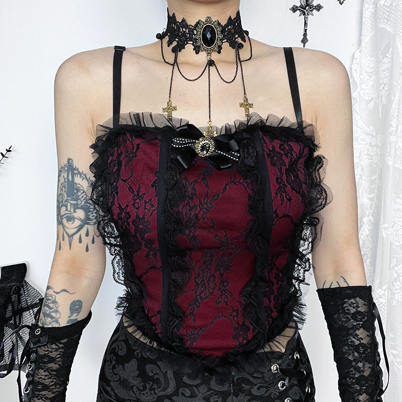 A person wearing a Maramalive™ Dark romantic lace top, featuring a burgundy and black gothic lace camisole paired with delicate lace gloves. The ensemble is completed with a choker and pendant, and the person's tattooed arms enhance the edgy aesthetic.