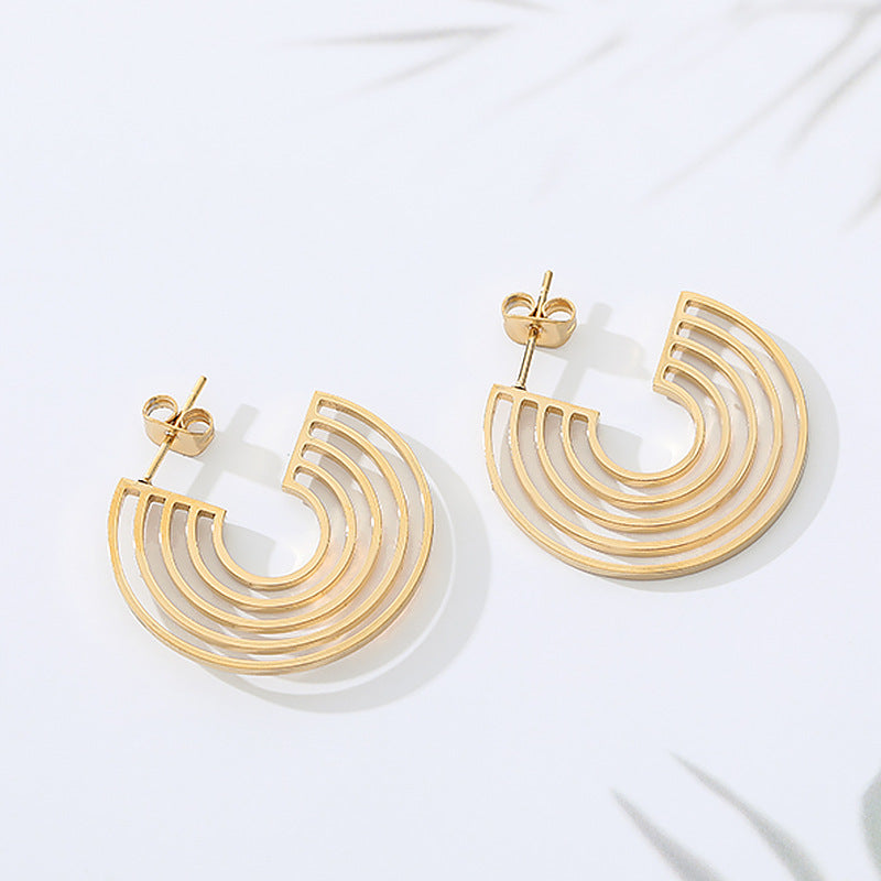 A pair of Stunning and Unusual Minimalist Geometric Stainless Steel Studs Semicircle on a plate by Maramalive™.