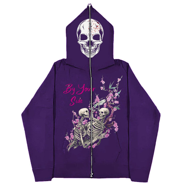 A purple Maramalive™ Gothic Zipper Sweater: The Perfect Gothic Top Multi-colors featuring a skull design on the hood and two skeletons surrounded by flowers, with the text "By Your Side" on the front.