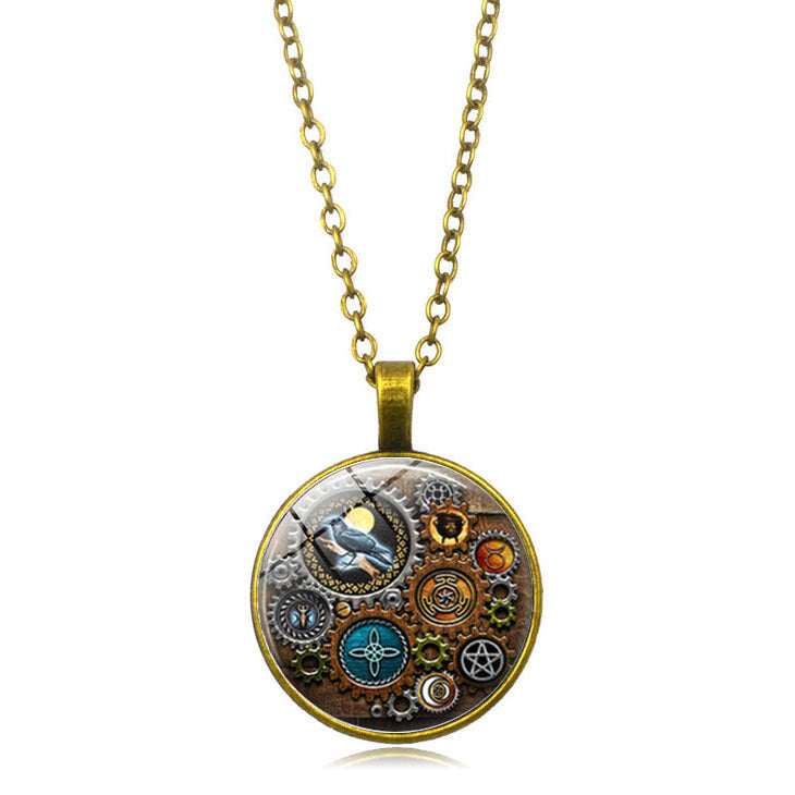 A hand holding a Steampunk Time Stone Necklace by Maramalive™ with a clock and gears on it.