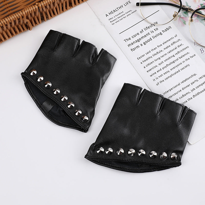 A pair of Maramalive™ PU Leather Steampunk Style Women's Half-finger Gloves Creative Gothic Party Cosplay with studs on them.