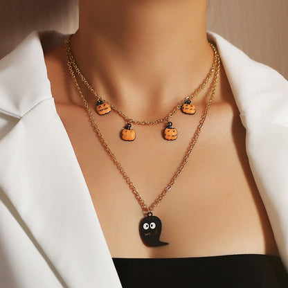A Halloween Funny Lip Pumpkin Necklace from Maramalive™ with black and red hearts on it.