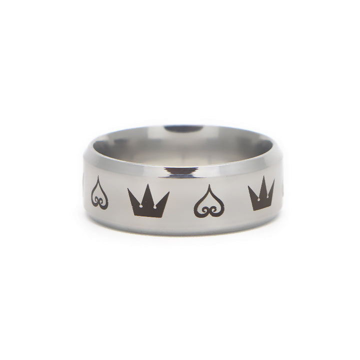 A man's hand is holding a Personality Trendy Hearts and Crowns Electroplated Ring with the brand name Maramalive™.