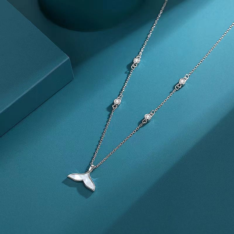 A S925 Sterling Silver Mermaid Necklace from Maramalive™ with a small bird on it.
