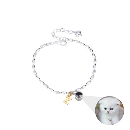 A Minimal Letter Bubble Bracelet with a white cat on it by Maramalive™.