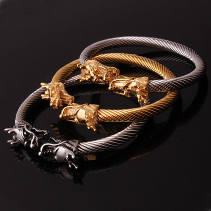 Three Maramalive™ Titanium Steel Wire Rope Dragon Mouth Open-ended Bracelets on a black surface.