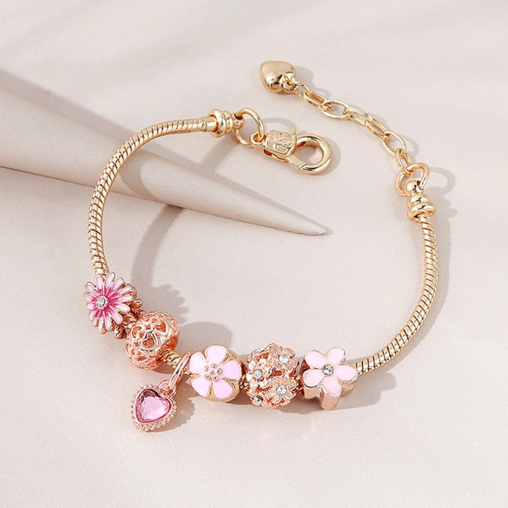 A Love Daisy Beaded Charm Bracelet With Zirconia and Ceramic Accents from Maramalive™ with pink charms and flowers.