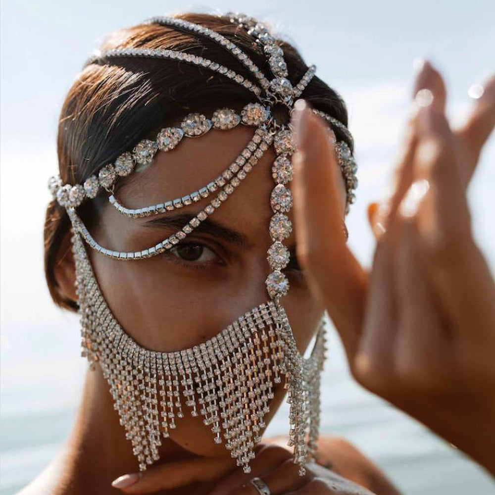 A woman in a green bikini wearing a Maramalive™ Women's Ethnic Style Diamonds Hair Chain Mask For Special Occasions.