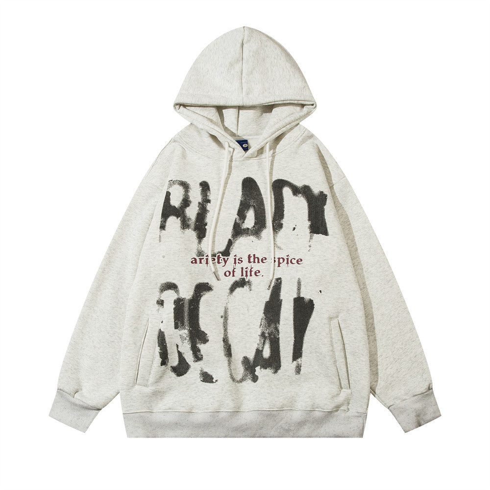 A light gray Maramalive™ Fuzzy Hooded Sweater: Cozy Men's Pullover for Chilly Days features abstract black prints and red text saying "anity is the spice of life.