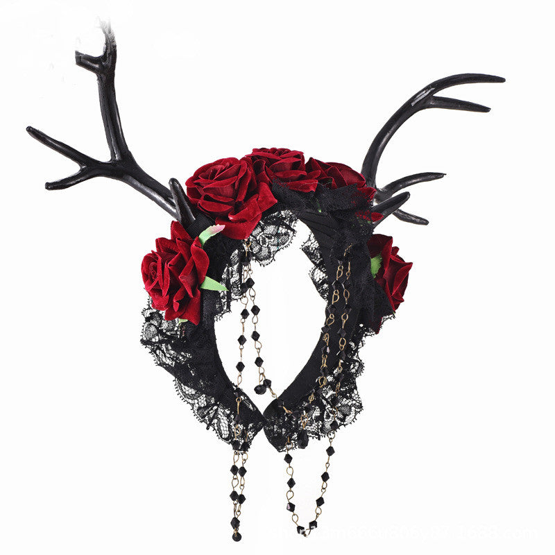 A Nightbloom Coronet: Mystical Flower Horns Gothic Antlers Rose Headband adorned with antlers and red roses, created by Maramalive™.