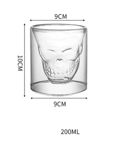 A cup of Skull Double-Layer Whiskey Glass from Maramalive™ is being poured into a glass.