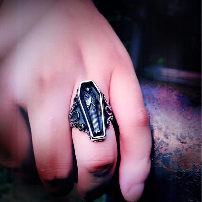 A Gothic Punk Vampire Coffin Men's Ring with a skull and coffin on it, from the brand Maramalive™.