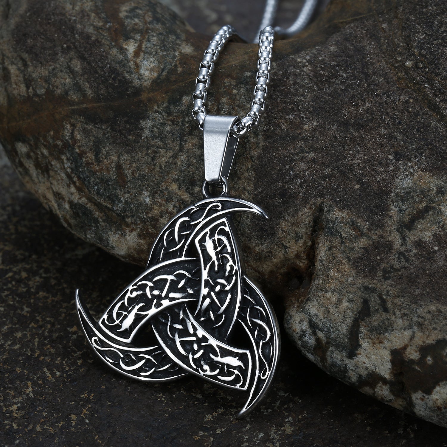 An Odin Horn Dragon Pendant Necklace on a rock. (Maramalive™)