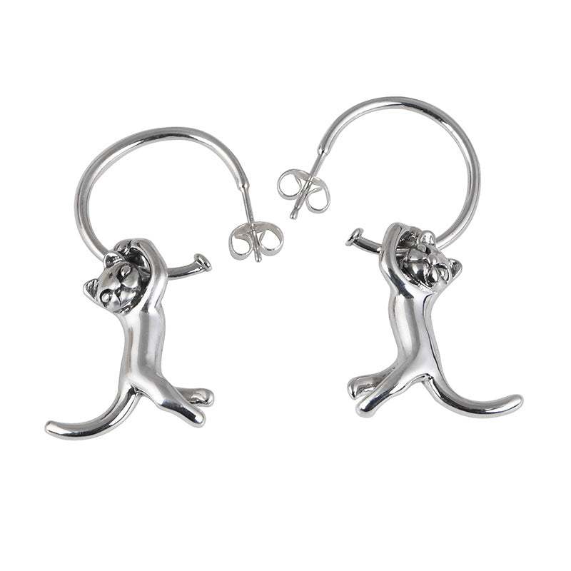 A pair of Retro Fashion Minimalism Design Kitten Earrings with a cat on them, from Maramalive™.