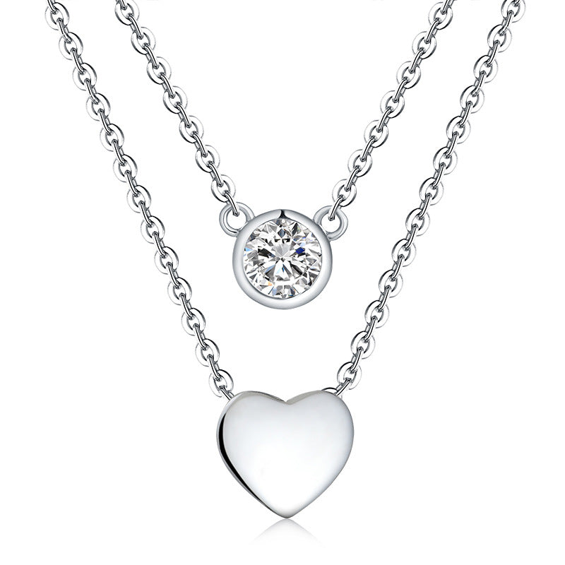 A woman wearing the Maramalive™ If You LOVE ME GET ME Women's Loving Heart Zircon Multi-layer Twin Necklace NOW.