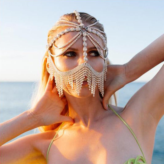 A woman in a green bikini wearing a Maramalive™ Women's Ethnic Style Diamonds Hair Chain Mask For Special Occasions.