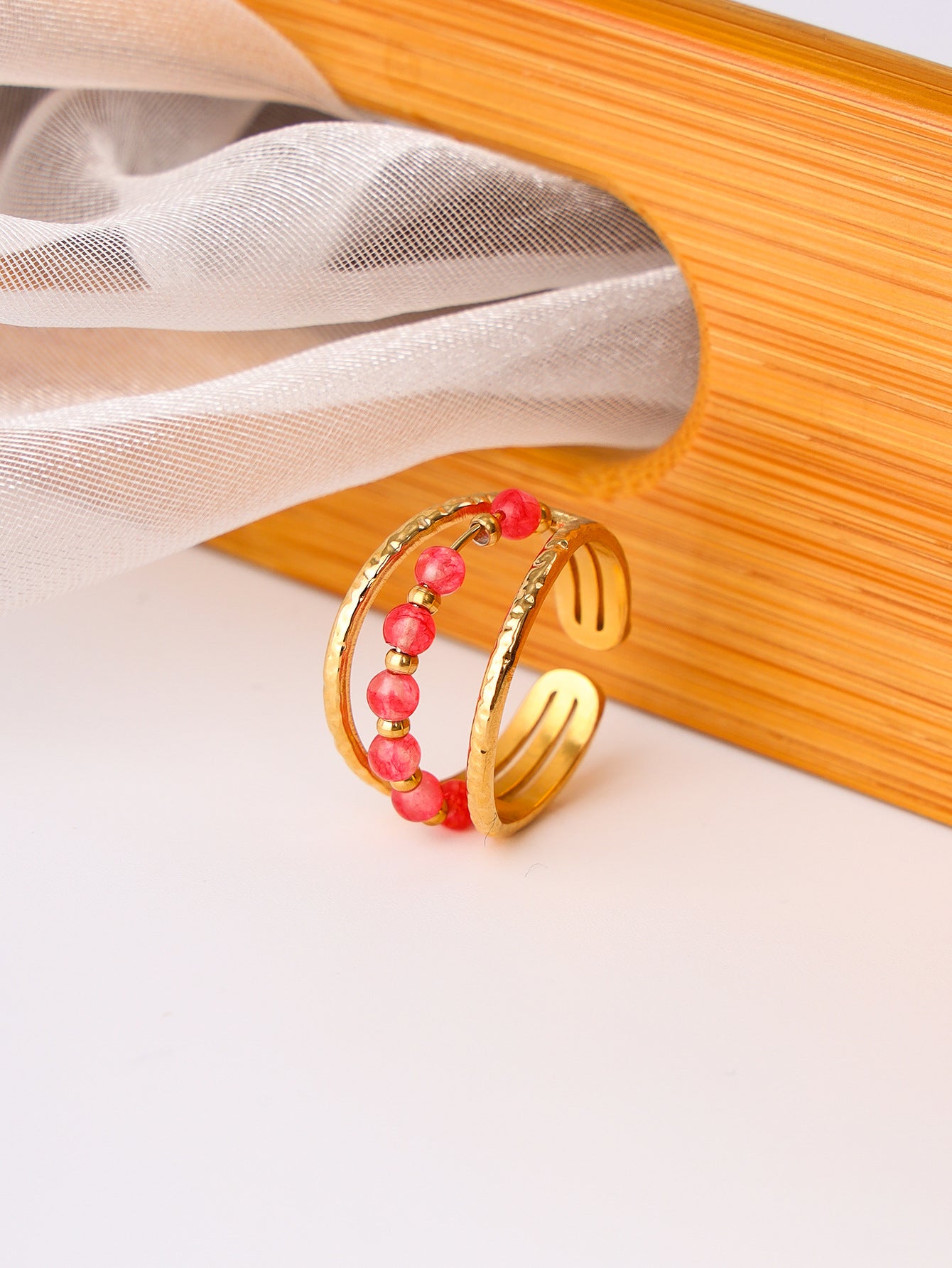A Maramalive™ gold plated ring with turquoise beads.